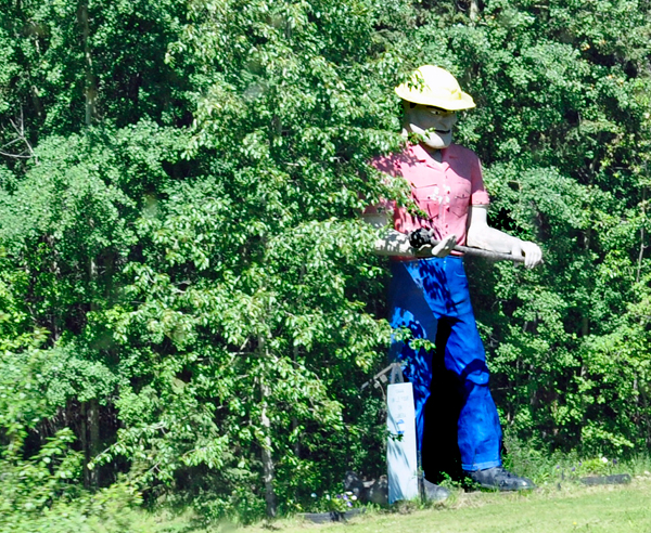 a giant dude hiding in the bushes